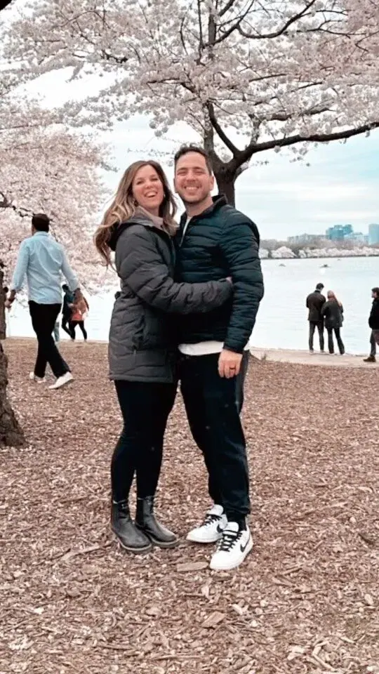 Joey and Amy under blossoming trees